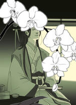 behind an orchid vase